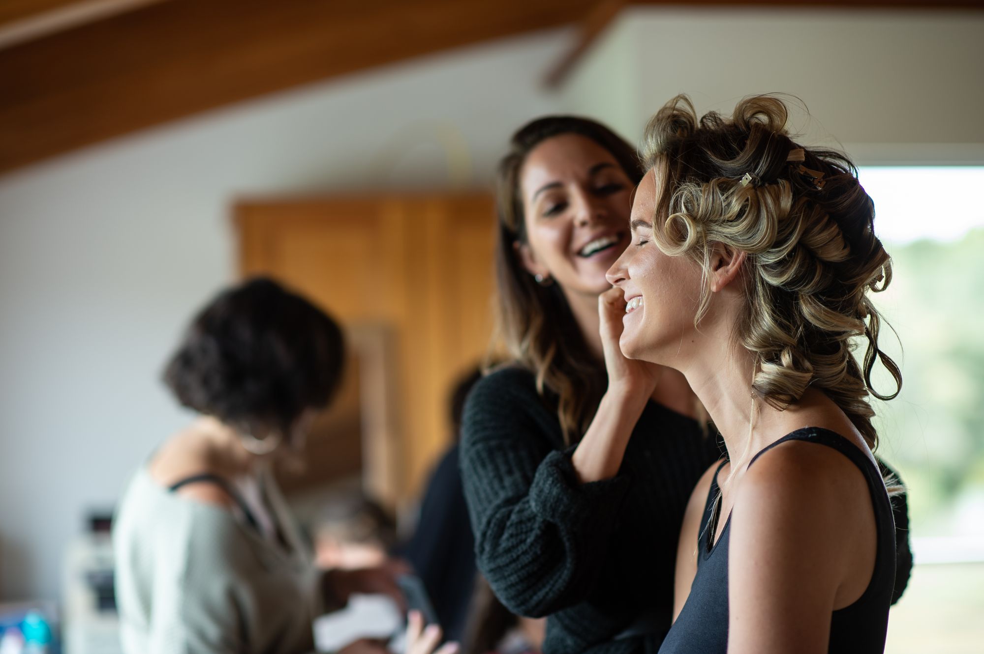 Lauren working with a client while getting ready